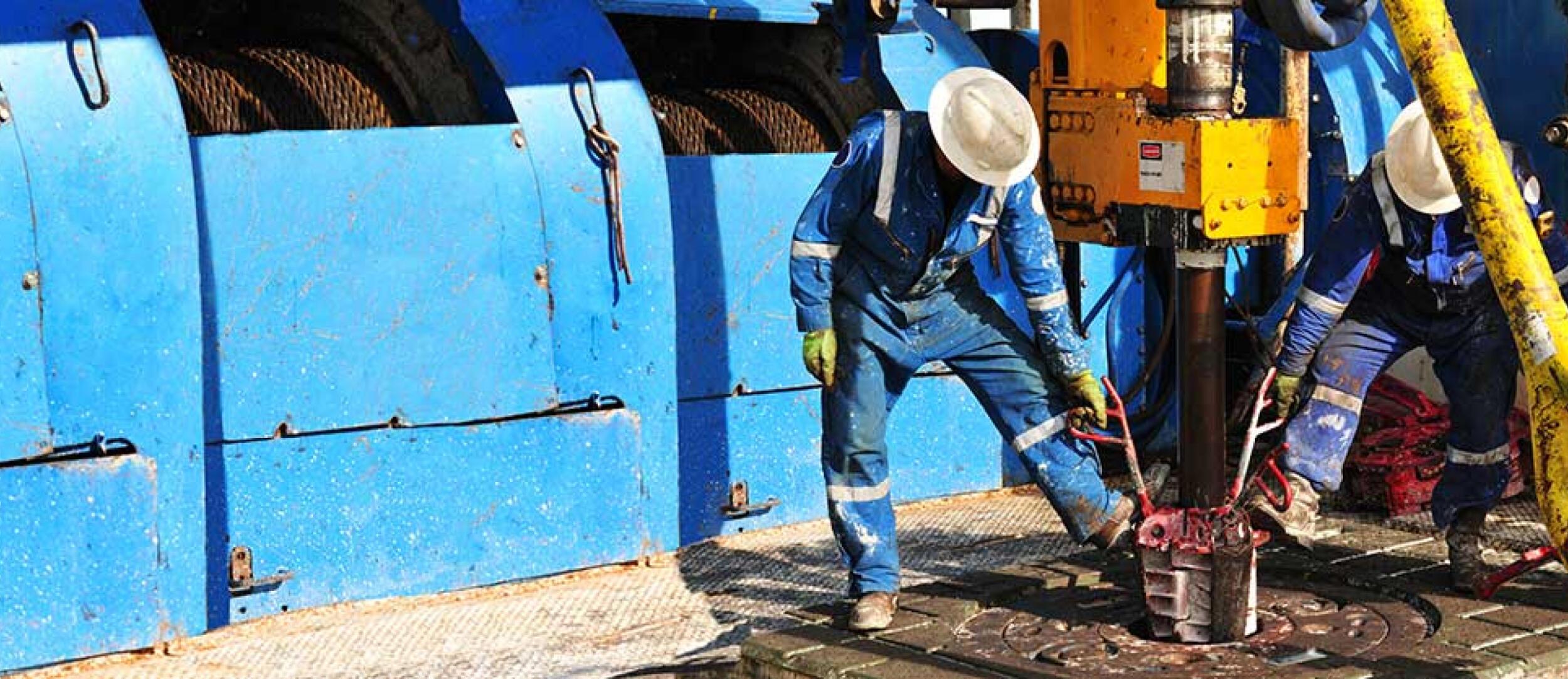 Rig workers on the drill floor of an oil rig