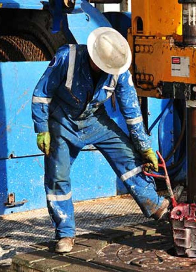 Rig workers on the drill floor of an oil rig