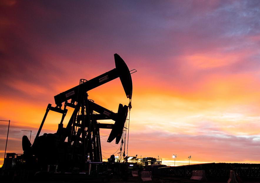 Pump jacks at sunset on an oil field
